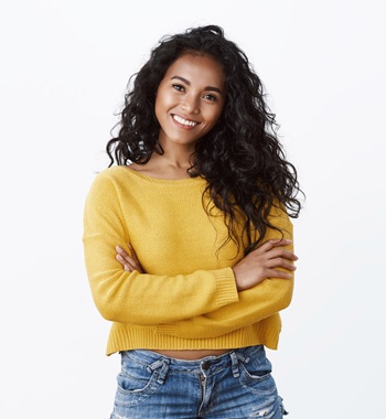 Happiness, wellbeing and confidence concept. Cheerful attractive african american woman curly haircut, cross arms chest in self-assured powerful pose, smiling determined, wear yellow sweater.